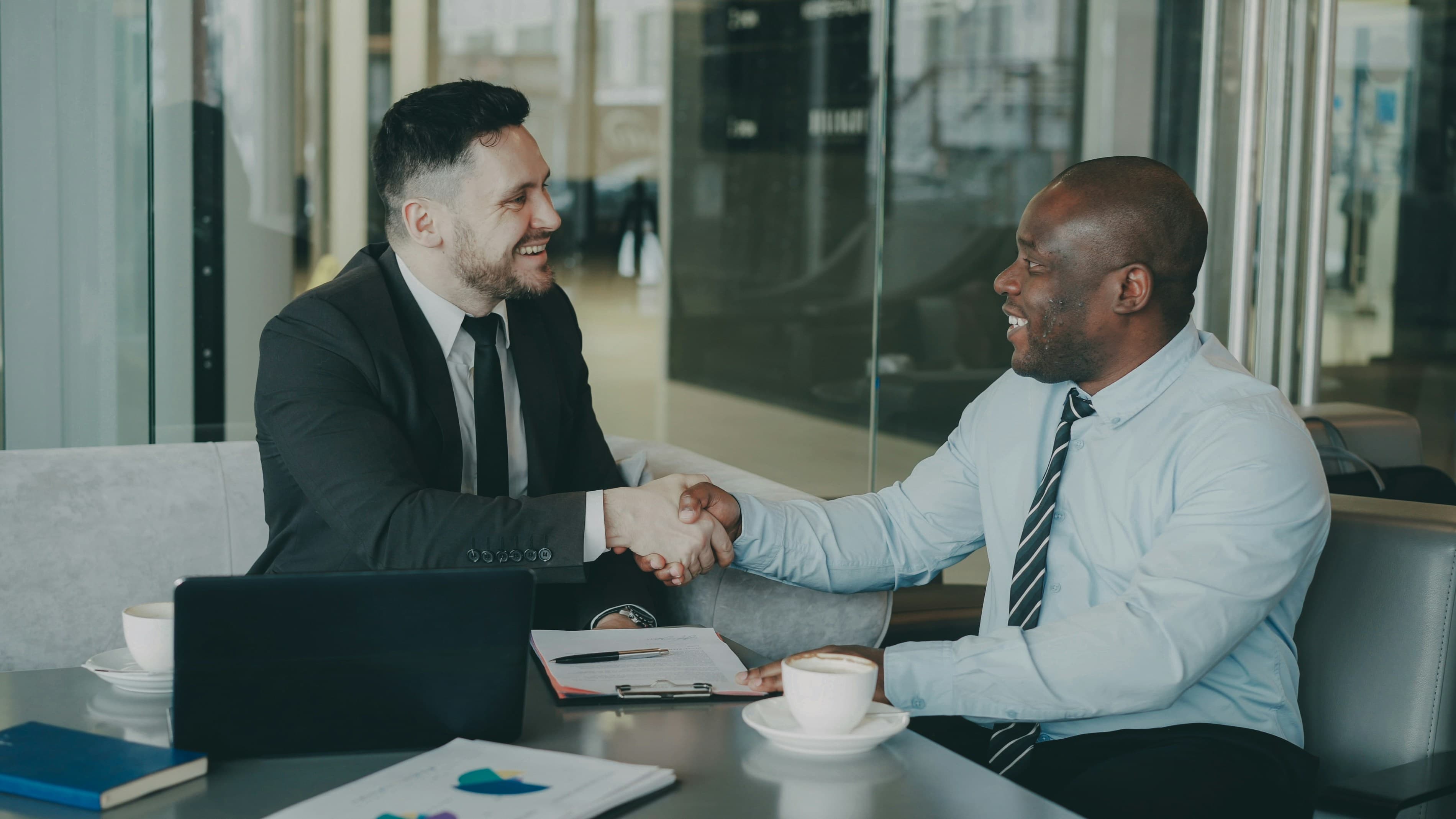 Business owners reviewing financing paperwork together